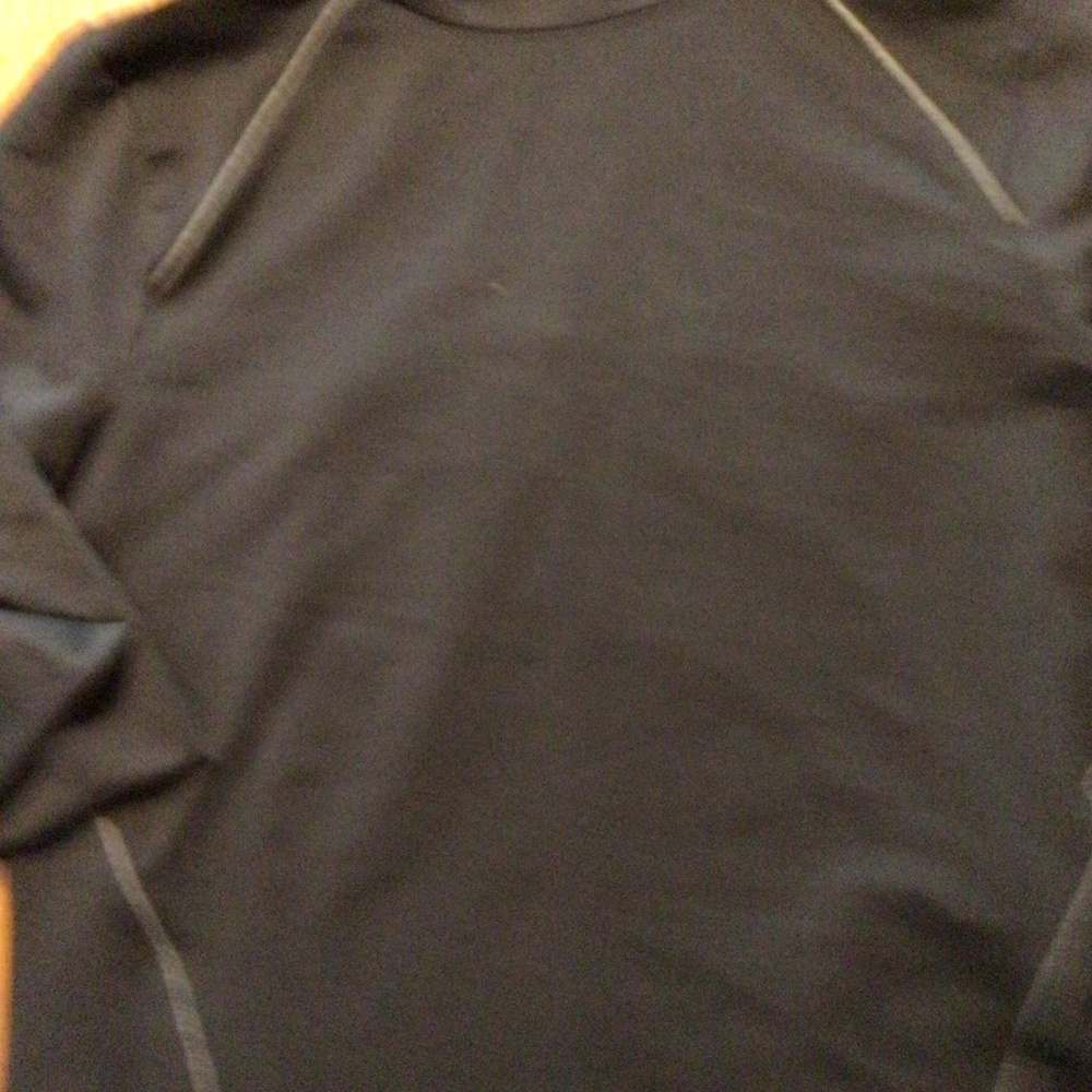 Activewear top by Under Armor.  Black with silver/gray trim. EUC.